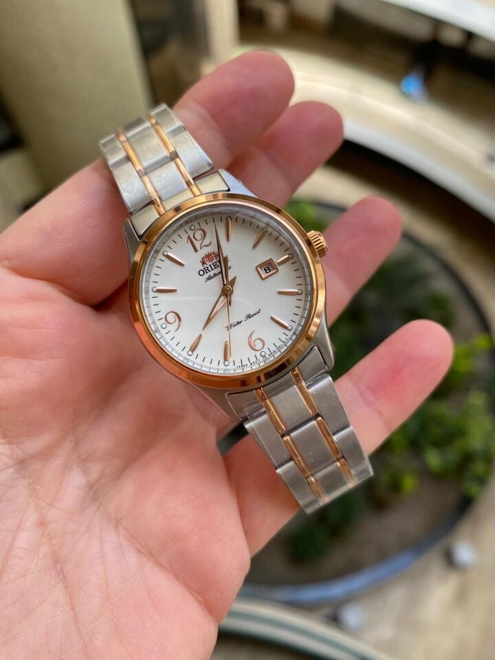 Orient FNR1Q002W0 Kurmalı Otomatik Çelik Rose/Gri Beyaz Kadran Kristal Cam 31 mm Kadın Kol Saati